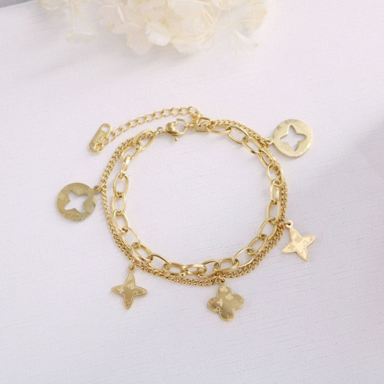 Unique gold Hollow Four-Leaf Clover Tassel Bracelet for Women, Non-Fading, Japanese and Korean Fashion, Prismatic Small Flower Hand Accessory